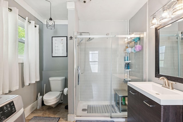 13 Bartlett St, Waterville, ME 04901 - full bathroom featuring vanity, a stall shower, toilet, and washer / clothes dryer