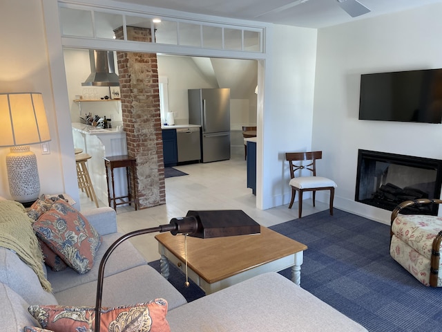 138 Limerock St Unit A, Rockland, ME 04841 - living room featuring a glass covered fireplace and lofted ceiling