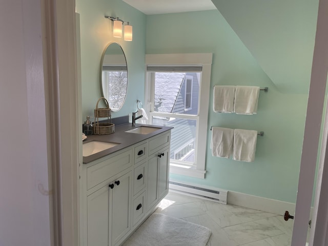 138 Limerock St Unit A, Rockland, ME 04841 - full bath with a baseboard heating unit, double vanity, marble finish floors, and plenty of natural light