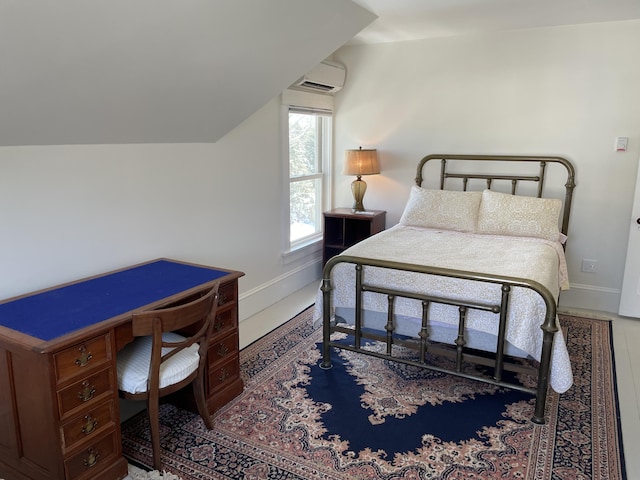 138 Limerock St Unit A, Rockland, ME 04841 - bedroom with baseboards and a wall mounted air conditioner