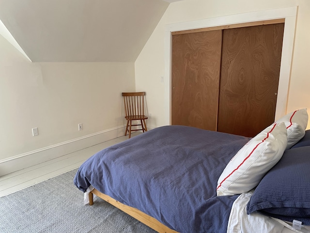 138 Limerock St Unit A, Rockland, ME 04841 - bedroom with lofted ceiling, carpet flooring, a closet, and baseboards