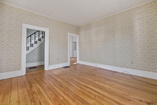 11 Center St, Richmond, ME 04357 - spare room with crown molding, light wood-type flooring, and wallpapered walls