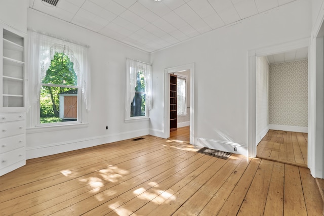 11 Center St, Richmond, ME 04357 - spare room with light wood-type flooring, healthy amount of natural light, and baseboards