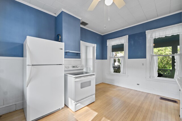11 Center St, Richmond, ME 04357 - kitchen with white appliances, ornamental molding, light wood-style flooring, ceiling fan, and wainscoting
