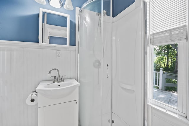 11 Center St, Richmond, ME 04357 - bathroom with wainscoting, a stall shower, and vanity
