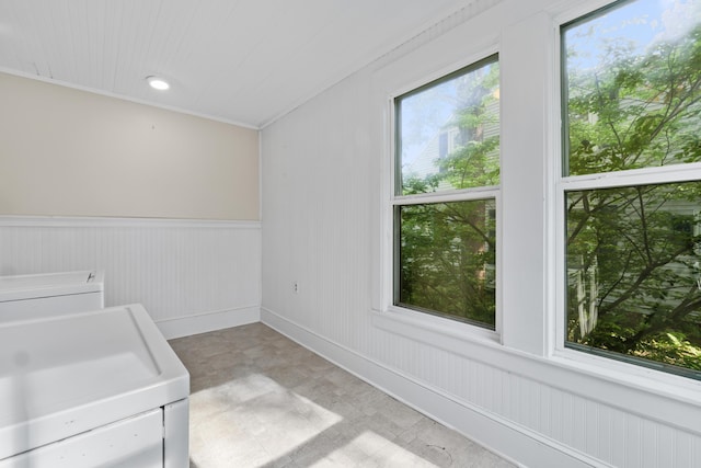 11 Center St, Richmond, ME 04357 - laundry area featuring washer and dryer, light floors, and a wainscoted wall