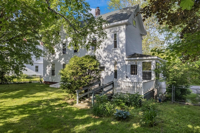 11 Center St, Richmond, ME 04357 - view of side of home featuring a chimney, a deck, and a shingled roof