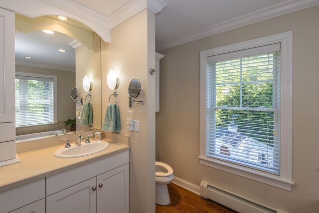 10 Clam Cove Dr, Rockport, ME 04856 - bathroom with a baseboard heating unit, toilet, vanity, ornamental molding, and wood finished floors