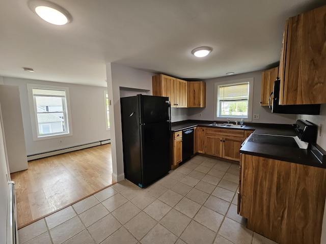42-44 Richardson St, Bath, ME 04530 - kitchen featuring black appliances, dark countertops, a sink, baseboard heating, and light tile patterned flooring