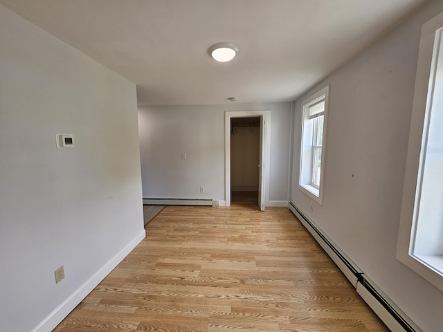 42-44 Richardson St, Bath, ME 04530 - empty room with a baseboard radiator, light wood-style floors, and baseboards