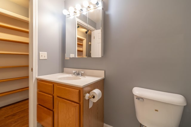 14 Carter Ln, Brewer, ME 04412 - half bath featuring vanity, toilet, and wood finished floors