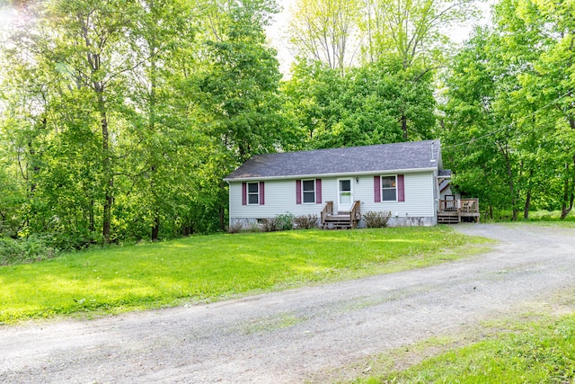 14 Carter Ln, Brewer, ME 04412 - view of front of house featuring dirt driveway, a front lawn, and a shingled roof