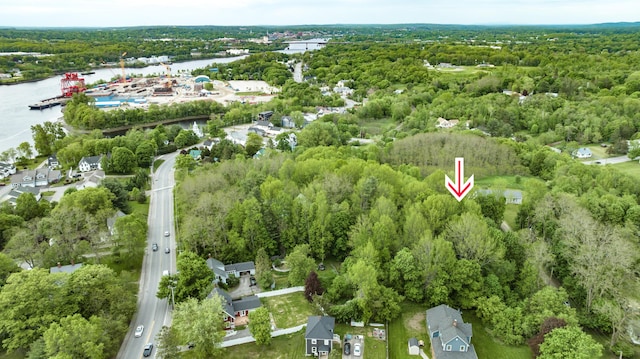 14 Carter Ln, Brewer, ME 04412 - aerial overview of property's location with a nearby body of water and a heavily wooded area