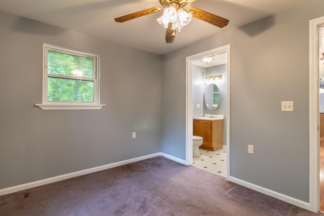 14 Carter Ln, Brewer, ME 04412 - unfurnished bedroom featuring baseboards, connected bathroom, carpet flooring, and a ceiling fan
