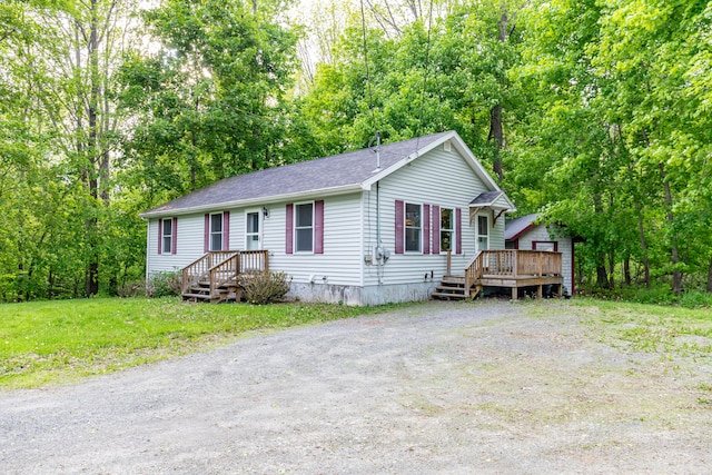 14 Carter Ln, Brewer, ME 04412 - view of front of house featuring a deck and a shingled roof