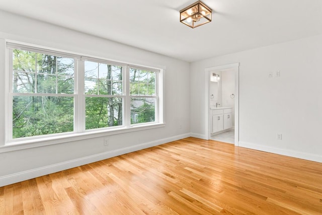 21 Arnies Alley -, Westbrook, ME 04092 - empty room featuring baseboards, light wood-style flooring, and a sink