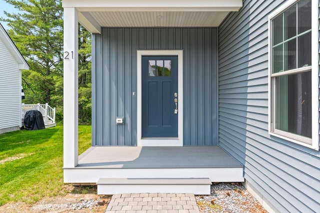 21 Arnies Alley -, Westbrook, ME 04092 - doorway to property with board and batten siding, a lawn, and covered porch