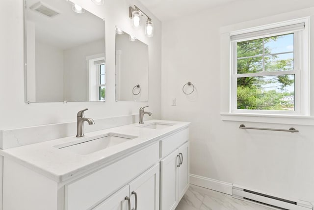 21 Arnies Alley -, Westbrook, ME 04092 - bathroom featuring a baseboard radiator, plenty of natural light, marble finish floors, and double vanity
