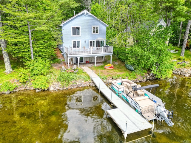 33-34 Gerber Ln, Monmouth, ME 04259 - back of house with stairs and a deck with water view