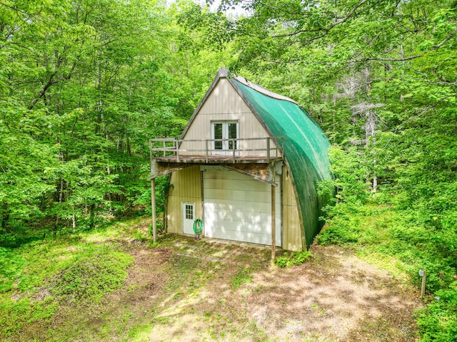 33-34 Gerber Ln, Monmouth, ME 04259 - view of outdoor structure with dirt driveway and a forest view