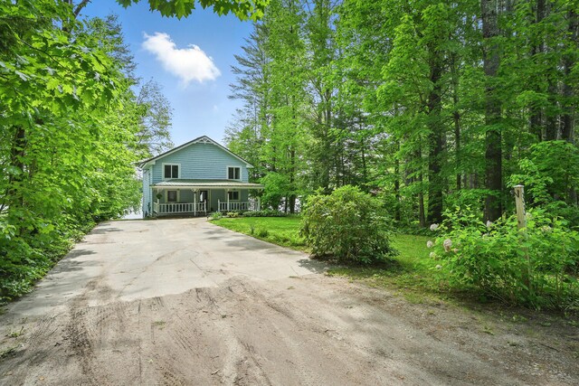 33-34 Gerber Ln, Monmouth, ME 04259 - view of front of house with driveway and covered porch