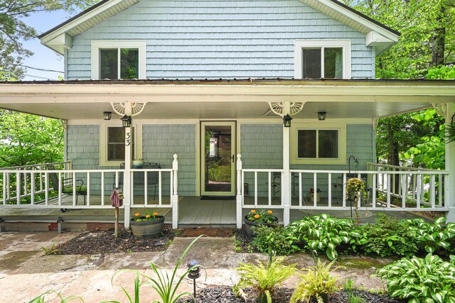 33-34 Gerber Ln, Monmouth, ME 04259 - view of front of home with covered porch
