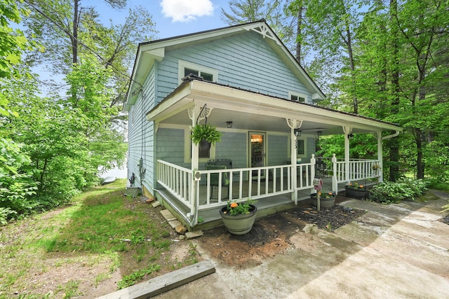 33-34 Gerber Ln, Monmouth, ME 04259 - view of front facade with covered porch
