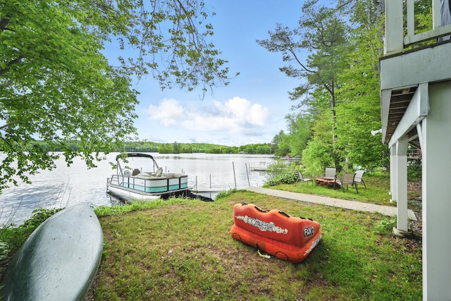 33-34 Gerber Ln, Monmouth, ME 04259 - view of green lawn featuring a dock and a water view