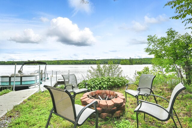 33-34 Gerber Ln, Monmouth, ME 04259 - view of patio / terrace featuring an outdoor fire pit, a water view, and a boat dock
