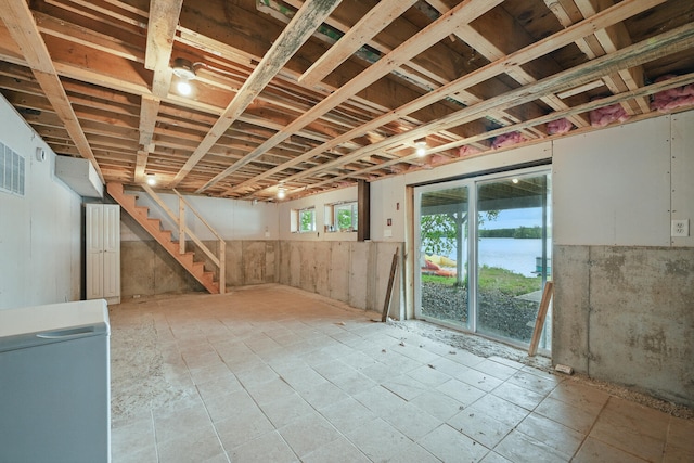 33-34 Gerber Ln, Monmouth, ME 04259 - basement with stairs and refrigerator