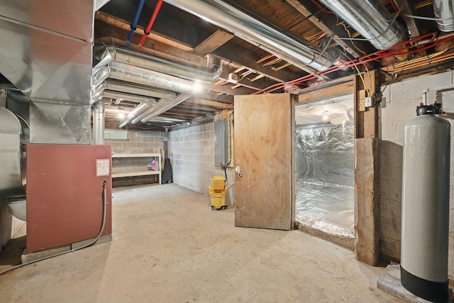 33-34 Gerber Ln, Monmouth, ME 04259 - unfinished below grade area featuring electric panel, a water softener, and heating unit
