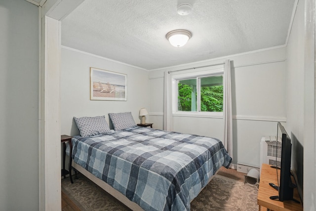 33-34 Gerber Ln, Monmouth, ME 04259 - bedroom with crown molding, wood finished floors, and a textured ceiling