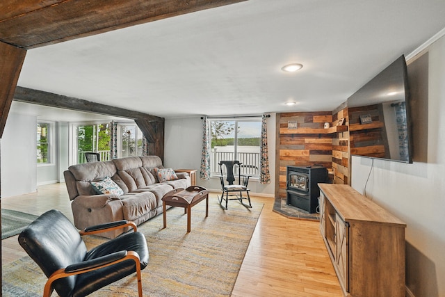33-34 Gerber Ln, Monmouth, ME 04259 - living area with a wood stove, plenty of natural light, light wood-style flooring, and recessed lighting
