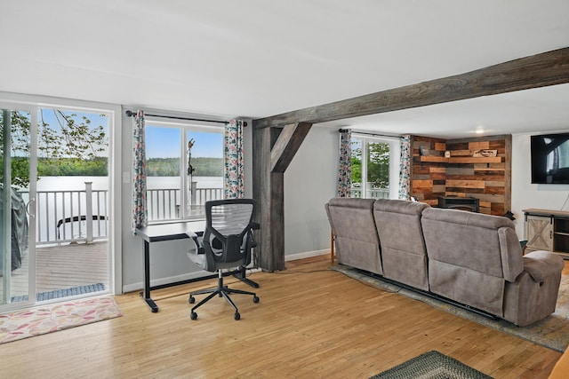 33-34 Gerber Ln, Monmouth, ME 04259 - home office featuring light wood-type flooring and a fireplace