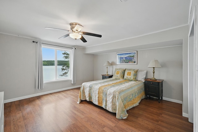 33-34 Gerber Ln, Monmouth, ME 04259 - bedroom with wood finished floors, crown molding, and a ceiling fan