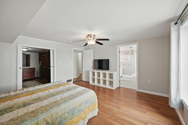 33-34 Gerber Ln, Monmouth, ME 04259 - bedroom featuring ensuite bathroom, wood finished floors, crown molding, and a ceiling fan