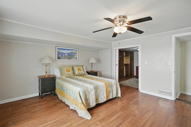 33-34 Gerber Ln, Monmouth, ME 04259 - bedroom with wood finished floors, crown molding, ceiling fan, and ensuite bathroom