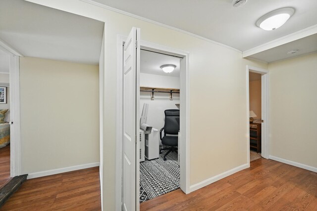 33-34 Gerber Ln, Monmouth, ME 04259 - hall with wood finished floors, crown molding, and a desk