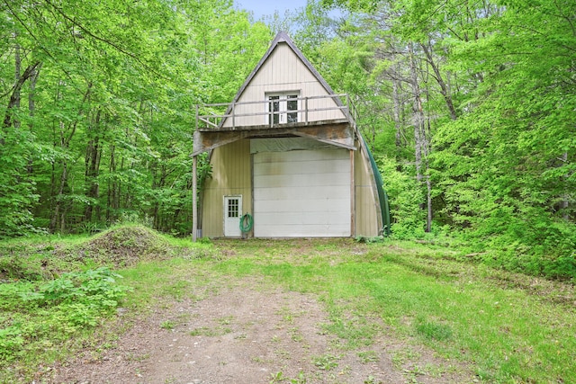 33-34 Gerber Ln, Monmouth, ME 04259 - garage with dirt driveway
