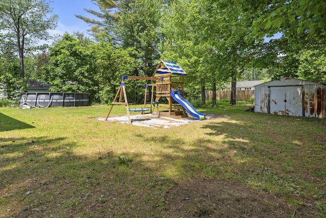 7 Dumas St, Lisbon, ME 04252 - view of yard featuring a storage shed, a playground, and an outdoor pool