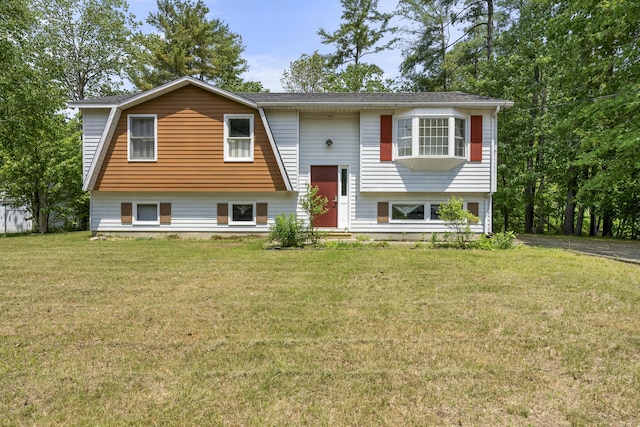 7 Dumas St, Lisbon, ME 04252 - raised ranch featuring a front lawn