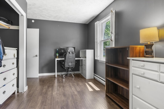 7 Dumas St, Lisbon, ME 04252 - office area featuring dark wood finished floors, a textured ceiling, and baseboard heating