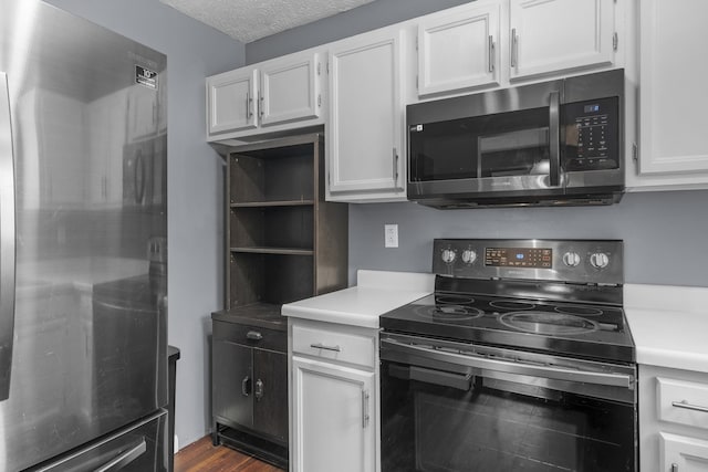 7 Dumas St, Lisbon, ME 04252 - kitchen with stainless steel appliances, white cabinets, light countertops, a textured ceiling, and open shelves