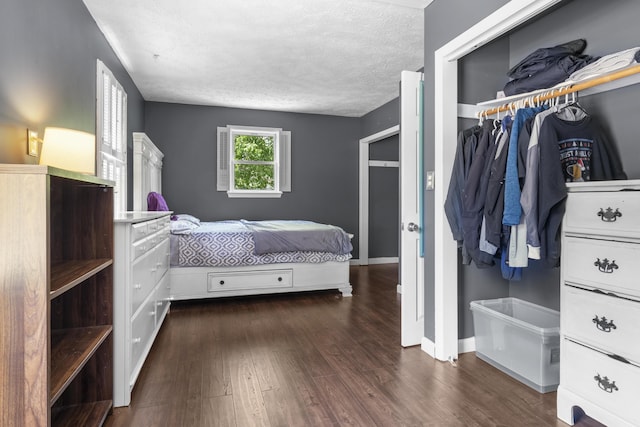 7 Dumas St, Lisbon, ME 04252 - bedroom with dark wood-style floors, a textured ceiling, and a closet
