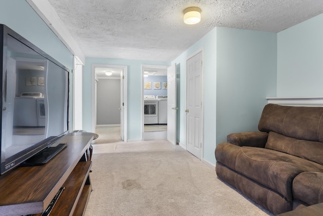 7 Dumas St, Lisbon, ME 04252 - living area with separate washer and dryer, carpet, and a textured ceiling