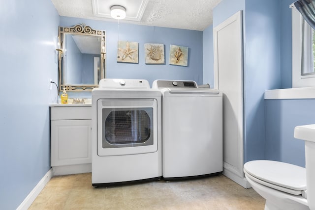 7 Dumas St, Lisbon, ME 04252 - washroom with separate washer and dryer, a textured ceiling, and attic access