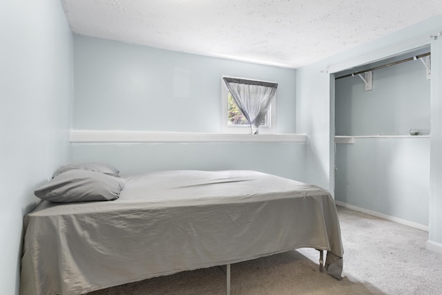 7 Dumas St, Lisbon, ME 04252 - bedroom with a textured ceiling, carpet flooring, and a closet