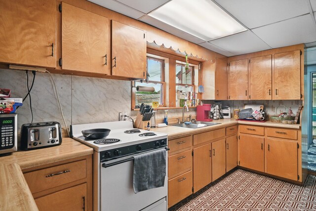 23 Main St, Athens, ME 04912 - kitchen featuring electric range, a sink, light countertops, and light floors