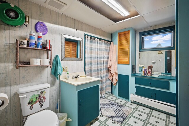 23 Main St, Athens, ME 04912 - full bath with wooden walls, vanity, toilet, a shower with curtain, and tile patterned floors