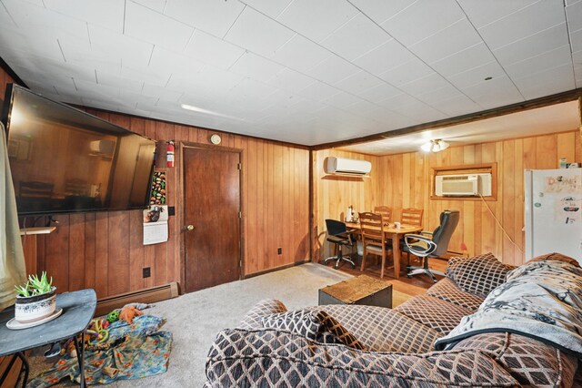 23 Main St, Athens, ME 04912 - living room with an AC wall unit, wooden walls, baseboard heating, and a wall mounted air conditioner